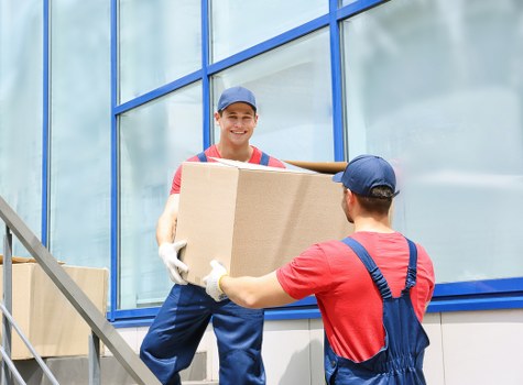 Fragile household items being wrapped for transport