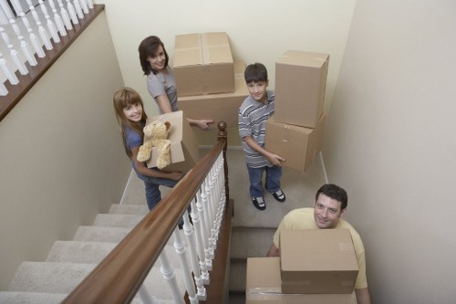 Packed household boxes and furniture ready for removals in a Westminster property